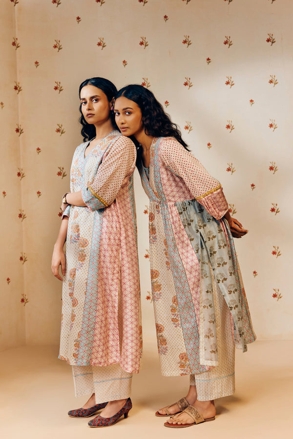 Off-white hand block printed cotton mulmul tunic set, designed with a light and airy silhouette, featuring delicate artisan patterns and made using sustainable practices."