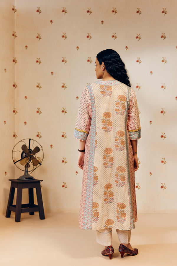 Off-white hand block printed cotton mulmul tunic set, designed with a light and airy silhouette, featuring delicate artisan patterns and made using sustainable practices."