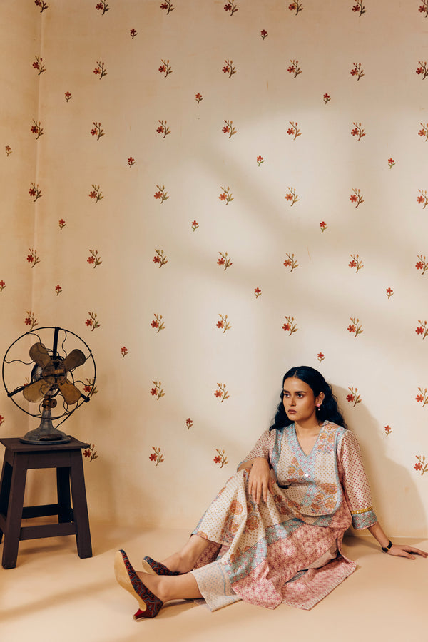 Off-white hand block printed cotton mulmul tunic set, designed with a light and airy silhouette, featuring delicate artisan patterns and made using sustainable practices."