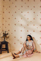 Off-white hand block printed cotton mulmul tunic set, designed with a light and airy silhouette, featuring delicate artisan patterns and made using sustainable practices."