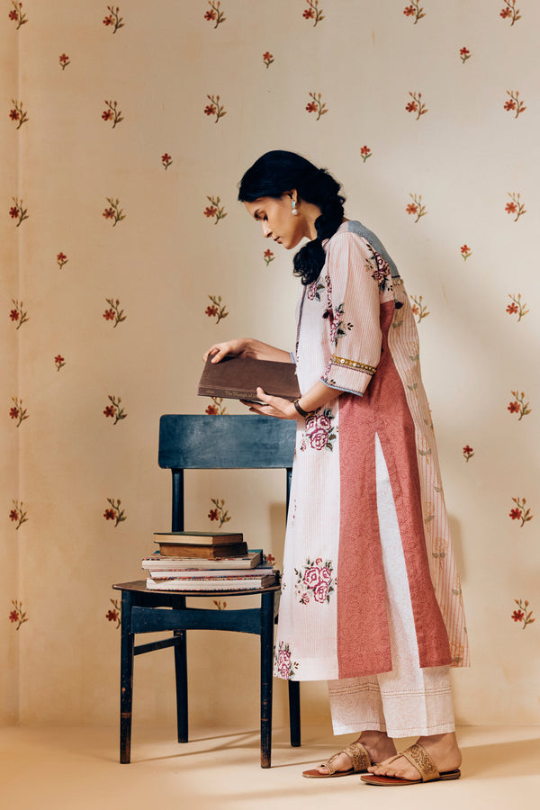 Off-white handwoven khadi cotton tunic with pink rose hand block print, paired with powder pink bandhani dot printed pants; a lightweight, handcrafted co-ord set perfect for summer wear.