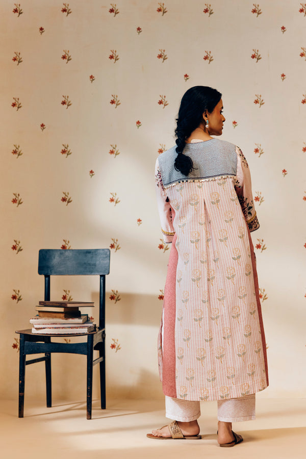 Off-white handwoven khadi cotton tunic with pink rose hand block print, paired with powder pink bandhani dot printed pants; a lightweight, handcrafted co-ord set perfect for summer wear.