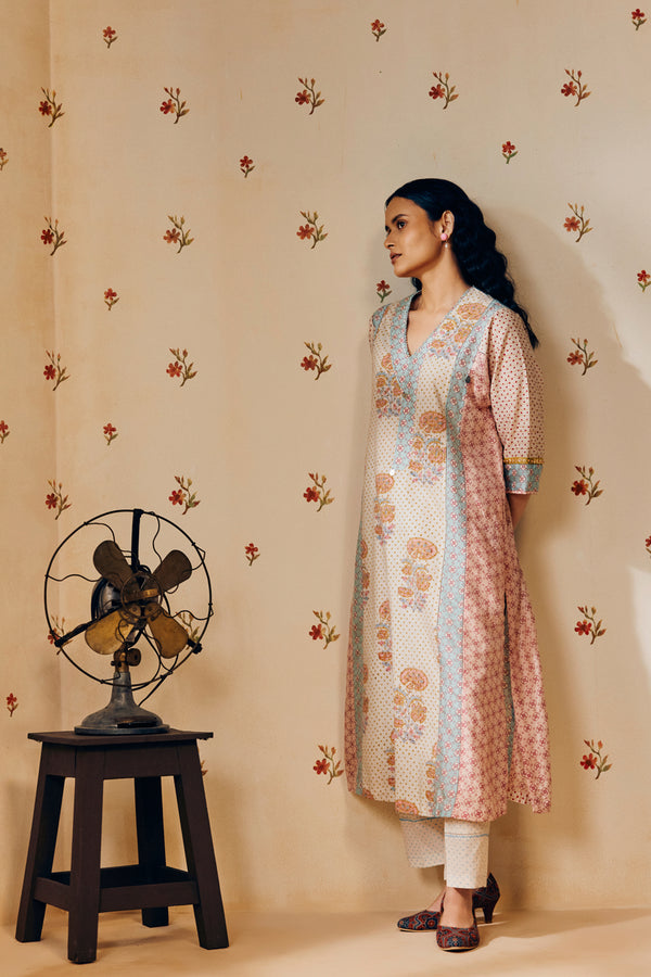 Off-white hand block printed cotton mulmul tunic set, designed with a light and airy silhouette, featuring delicate artisan patterns and made using sustainable practices."