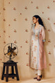 Off-white hand block printed cotton mulmul tunic set, designed with a light and airy silhouette, featuring delicate artisan patterns and made using sustainable practices."