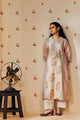 Off-white hand block printed cotton mulmul tunic set, designed with a light and airy silhouette, featuring delicate artisan patterns and made using sustainable practices."
