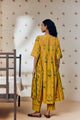 "Mustard tunic set with hand block rose prints, crafted from soft, breathable fabric, blending timeless artisan craft with effortless elegance."