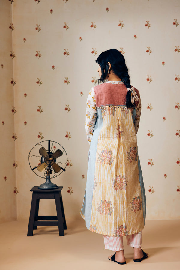 Summer off-white handwoven khadi cotton tunic with mustard and powder pink poppy hand block print, paired with powder pink striped pants; a lightweight, handcrafted co-ord set perfect for warm-weather styling.