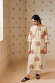 Summer-ready off-white handwoven khadi cotton tunic with mustard stripes and overlapping pink rose hand block print, paired with off-white pants featuring subtle purple microdot print; a handcrafted ethnic co-ord set in breathable cotton.