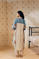 "Off-white hand block printed cotton mulmul tunic set featuring minimalist design with intricate artisan detailing, offering breathable comfort and timeless elegance."