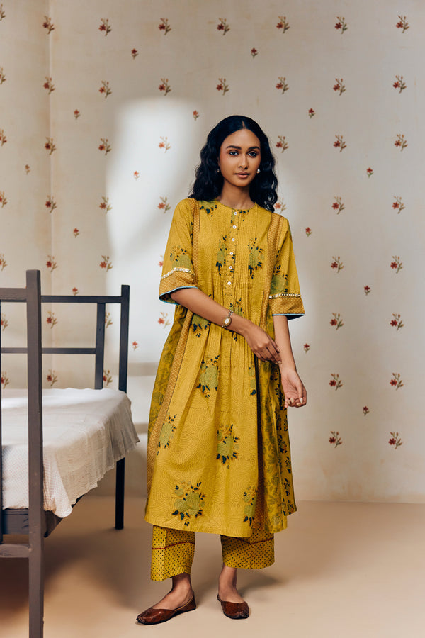 "Mustard tunic set with hand block rose prints, crafted from soft, breathable fabric, blending timeless artisan craft with effortless elegance."
