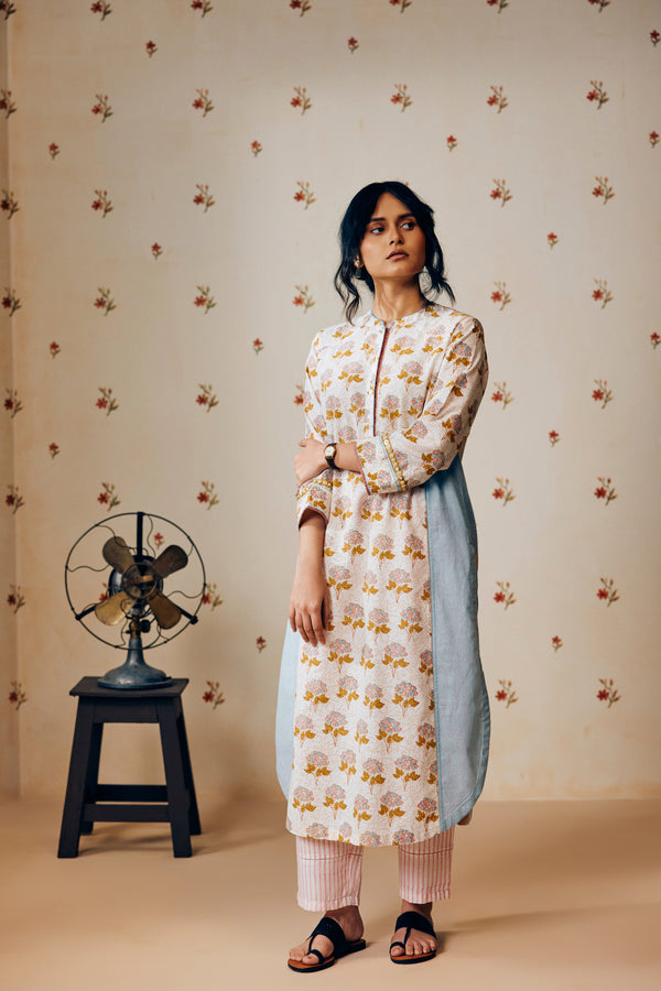 Summer off-white handwoven khadi cotton tunic with mustard and powder pink poppy hand block print, paired with powder pink striped pants; a lightweight, handcrafted co-ord set perfect for warm-weather styling.