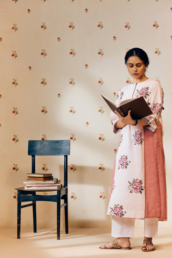 Off-white handwoven khadi cotton tunic with pink rose hand block print, paired with powder pink bandhani dot printed pants; a lightweight, handcrafted co-ord set perfect for summer wear.