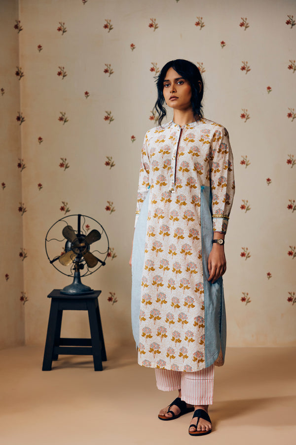 Summer off-white handwoven khadi cotton tunic with mustard and powder pink poppy hand block print, paired with powder pink striped pants; a lightweight, handcrafted co-ord set perfect for warm-weather styling.