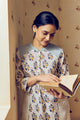 Summer-perfect off-white handwoven khadi cotton tunic featuring blue and mustard flower bunch hand block print, paired with dark blue striped pants; a breathable, handcrafted ethnic co-ord set ideal for warm weather.