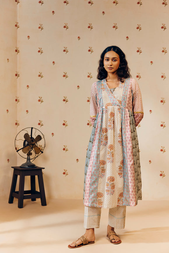 Off-white empire cut tunic set with marigold block prints, inspired by nature and ethically made from soft, breathable fabric for a graceful, sustainable look.