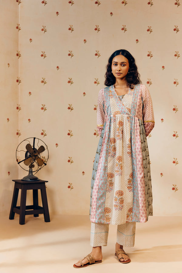 Off-white empire cut tunic set with marigold block prints, inspired by nature and ethically made from soft, breathable fabric for a graceful, sustainable look.
