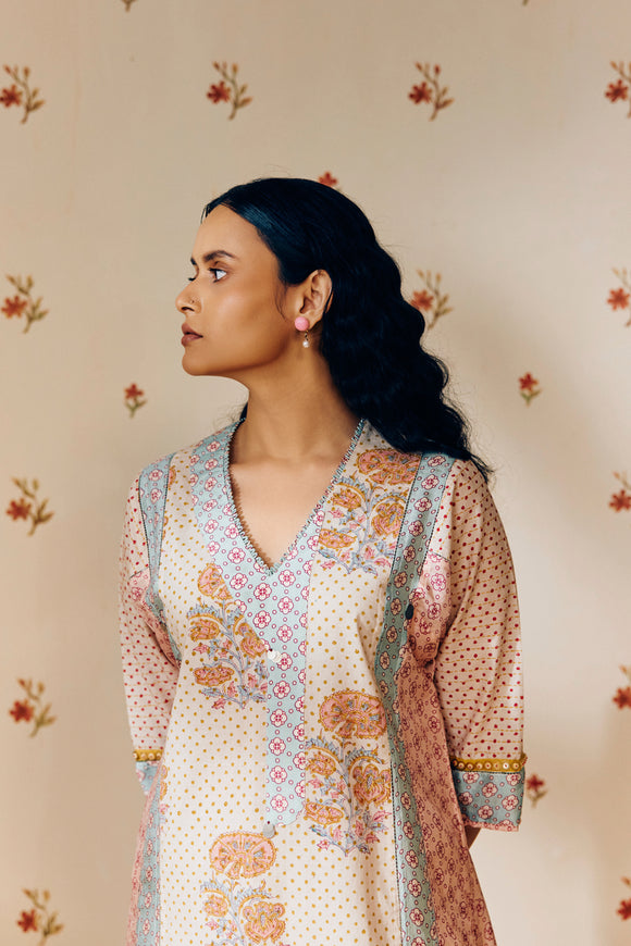 Off-white hand block printed cotton mulmul tunic set, designed with a light and airy silhouette, featuring delicate artisan patterns and made using sustainable practices."