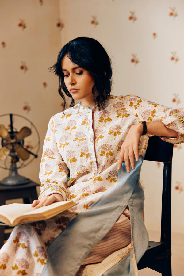 Summer off-white handwoven khadi cotton tunic with mustard and powder pink poppy hand block print, paired with powder pink striped pants; a lightweight, handcrafted co-ord set perfect for warm-weather styling.
