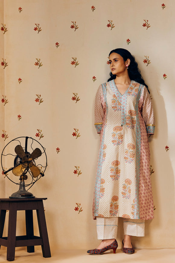 Off-white hand block printed cotton mulmul tunic set, designed with a light and airy silhouette, featuring delicate artisan patterns and made using sustainable practices."