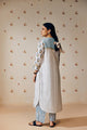 Summer-perfect off-white handwoven khadi cotton tunic featuring blue and mustard flower bunch hand block print, paired with dark blue striped pants; a breathable, handcrafted ethnic co-ord set ideal for warm weather.